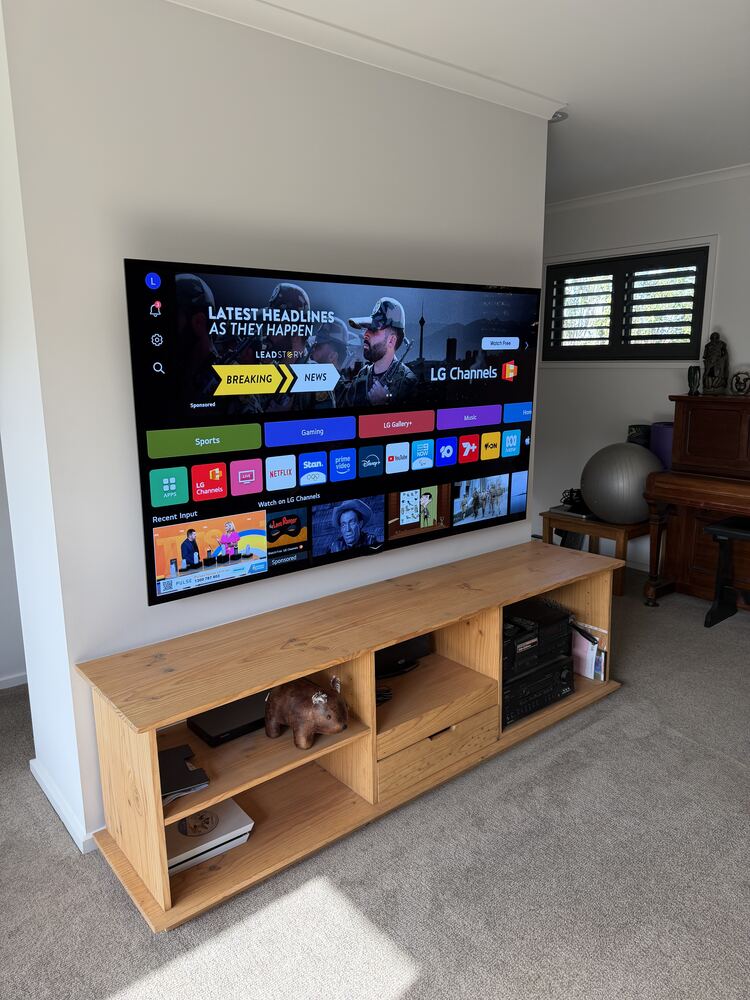 Wall-mounted TV with concealed wiring and entertainment unit
